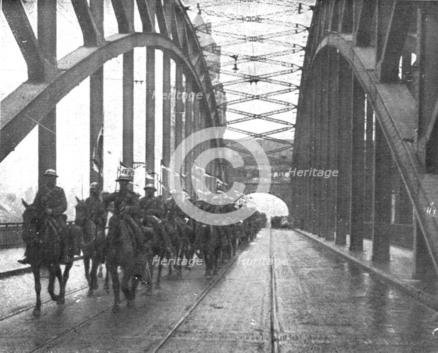 'Les Anglais sur le Rhin; A Cologne, Lanciers britanniques passant le Rhin a Cologne..., 1918. Creator: Jean Clair-Guyot.