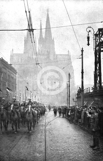 'Les Anglais sur le Rhin; A Cologne, Le defile de la cavalerie britannique a Cologne..., 1918. Creator: Jean Clair-Guyot.
