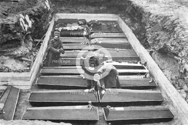 'Les Funerailles des Morts de la Revolution; Les cercueils ranges dans la fosse, au Champ..., 1917. Creator: Unknown.
