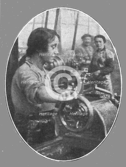 'Les femmes dans les usines de guerre; Une jeune Parisienne travaillant a l'evidement..., 1916. Creator: Unknown.