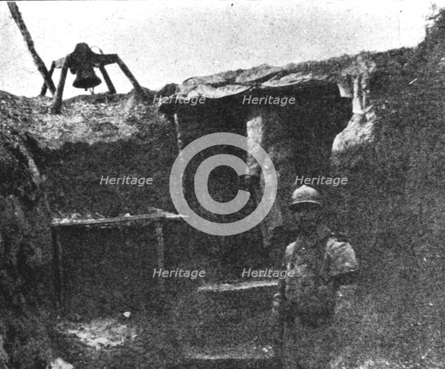 'Les Gaz Allemands; Cloche installee pres d'un abri de guetteur pour lui..., 1916. Creator: Unknown.