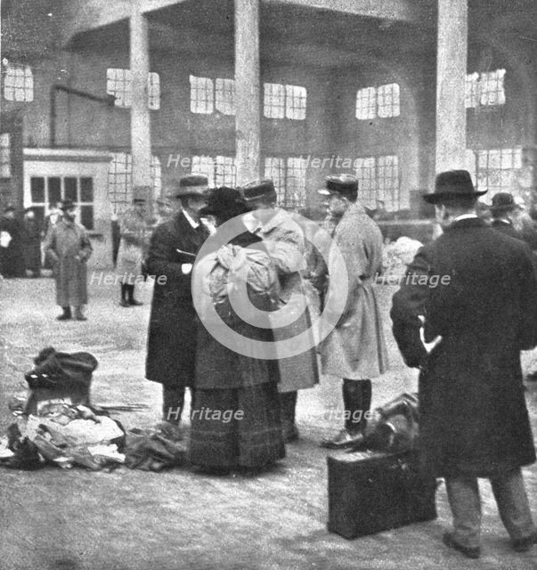 'Les Indesirables; Examen des pieces d'identite d'un professeur d'une ecole de Mulhouse..., 1918. Creator: Unknown.