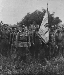 Les Russes en France; le general Lohvitsky et la drapeau sur lequel est brodee la figure..., 1916. Creator: Unknown