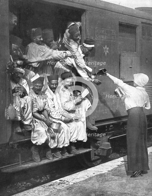 ''Les Turcos; Un arret dans une Gare d'un train de Tirailleurs', 1914. Creator: Unknown.