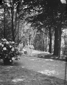 Leslie, Margeurite, and unidentified couple, walking in the woods, 1917 Aug. 18. Creator: Arnold Genthe