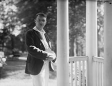 Leslie, Margeurite, friend of, standing on a porch, 1917 Aug. 18. Creator: Arnold Genthe