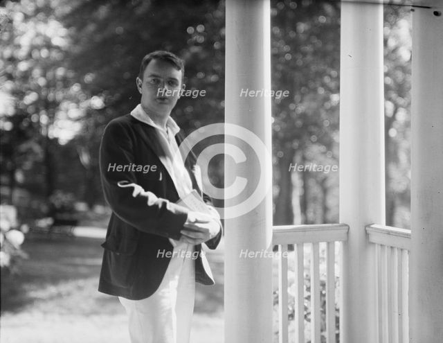 Leslie, Margeurite, friend of, standing on a porch, 1917 Aug. 18. Creator: Arnold Genthe.