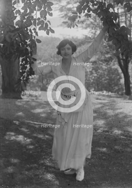 Leslie, Margeurite, standing outdoors, 1917 Aug. 18. Creator: Arnold Genthe.