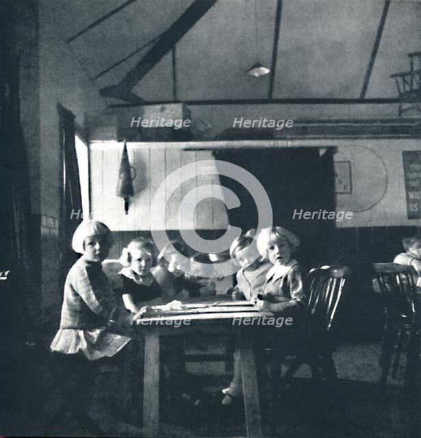 'Lessons for London children in the village hall', 1941. Artist: Cecil Beaton.