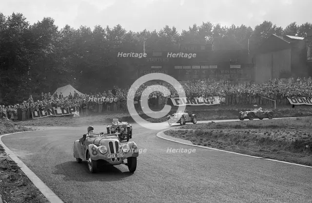 LG Johnson's Frazer-Nash BMW 328 leading two MG PBs, Imperial Trophy, Crystal Palace, 1939. Artist: Bill Brunell.
