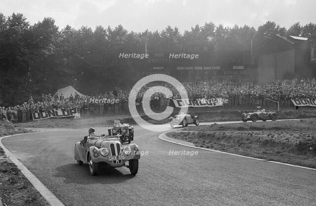 LG Johnson's Frazer-Nash BMW 328 leading two MG PBs, Imperial Trophy, Crystal Palace, 1939. Artist: Bill Brunell.