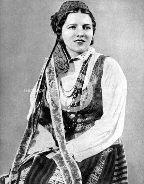 Lithuanian woman in traditional dress, 1936. Artist: Geoffrey L Portham