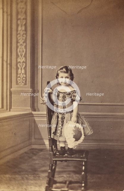 Little girl standing on a chair, 1865-1875. Creator: Frederick Downer & Sons.