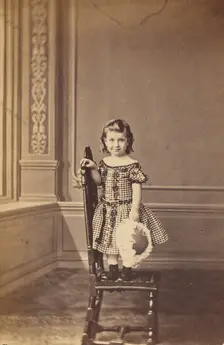 Little girl standing on a chair, 1865-1875. Creator: Frederick Downer & Sons