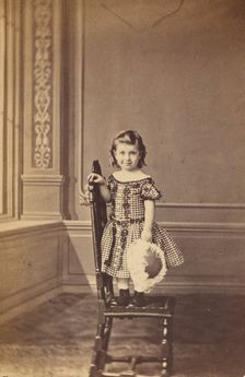 Little girl standing on a chair, 1865-1875. Creator: Frederick Downer & Sons