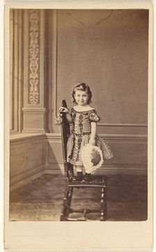 Little girl standing on a chair, 1865-1875. Creator: Frederick Downer & Sons