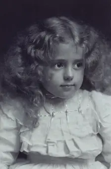 Little girl with fair, wavy hair, c1900. Creator: Addie Kilburn Robinson