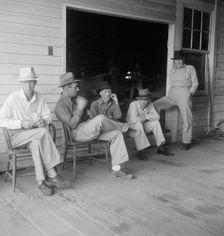 Livery stable gang talking politics...country of Senator "Cotton Ed" Smith, South Carolina, 1938. Creator: Dorothea Lange