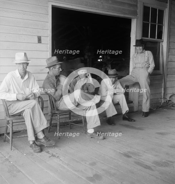 Livery stable gang talking politics...country of Senator "Cotton Ed" Smith, South Carolina, 1938. Creator: Dorothea Lange.