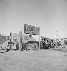 Living conditions for migratory laborers in private auto camp, Calipatria, Imperial County, 1939. Creator: Dorothea Lange