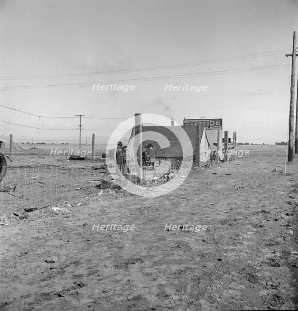 Living conditions for migratory laborers in private auto camp, Calipatria, Imperial County, 1939. Creator: Dorothea Lange.