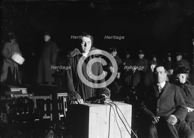 Liberty Loans - Mrs. Mcadoo Lighting Bonfire, 1917. Creator: Harris & Ewing.