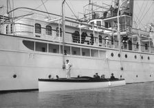 Liberty's motor launch alongside Liberty 1914. Creator: Kirk & Sons of Cowes