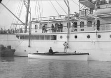 Liberty's motor launch alongside Liberty 1914. Creator: Kirk & Sons of Cowes
