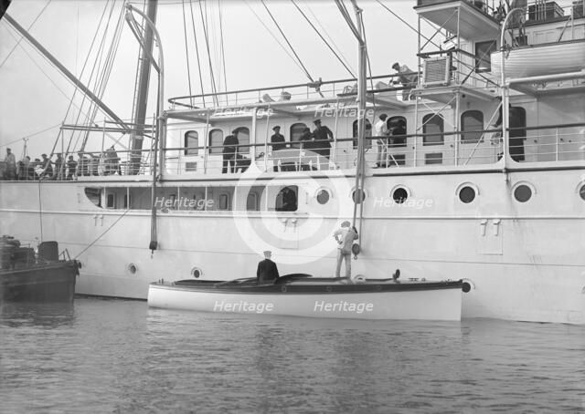 Liberty's motor launch alongside 'Liberty', 1914. Creator: Kirk & Sons of Cowes.