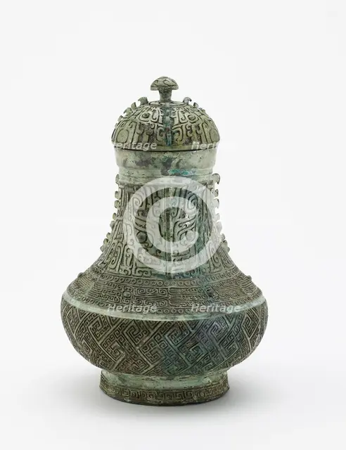 Lidded ritual wine container (hu) with masks and dragons, Late Shang dynasty, c13th century BCE. Creator: Unknown.