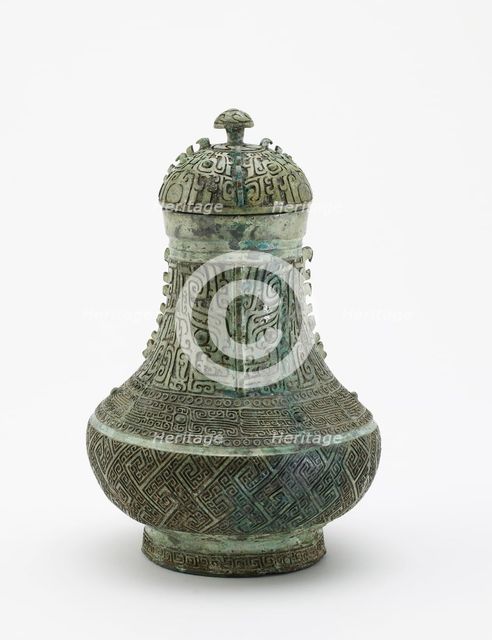 Lidded ritual wine container (hu) with masks and dragons, Late Shang dynasty, c13th century BCE. Creator: Unknown.