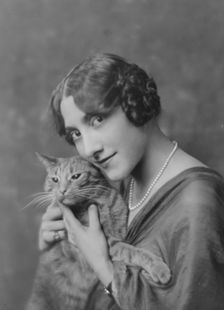 Liebert, M., Miss, with Buzzer the cat, portrait photograph, between 1916 and 1927. Creator: Arnold Genthe