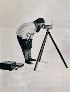 Lieut. Pennell with a Prismatic Compass December 1910, (1913). Artist: Herbert Ponting