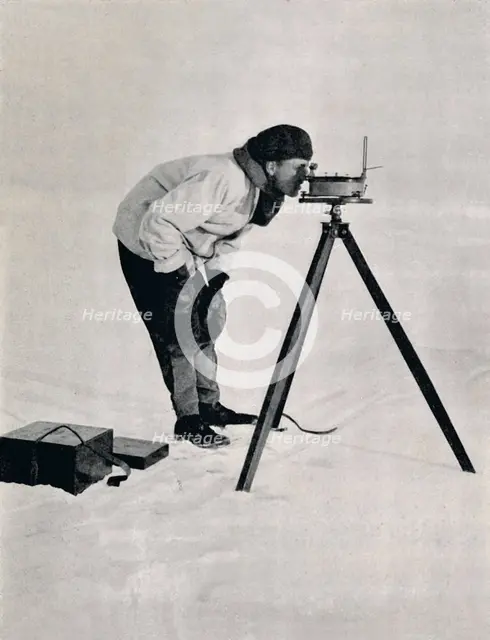 'Lieut. Pennell with a Prismatic Compass', December 1910, (1913). Artist: Herbert Ponting.