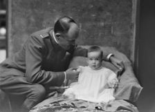 Lieutenant H.B. Stimson and baby, portrait photograph, 1918 May 8. Creator: Arnold Genthe
