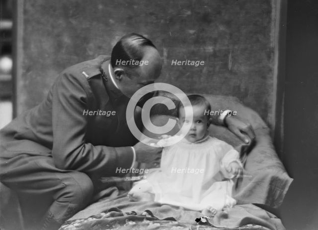 Lieutenant H.B. Stimson and baby, portrait photograph, 1918 May 8. Creator: Arnold Genthe.
