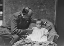 Lieutenant H.B. Stimson and baby, portrait photograph, 1918 May 8. Creator: Arnold Genthe