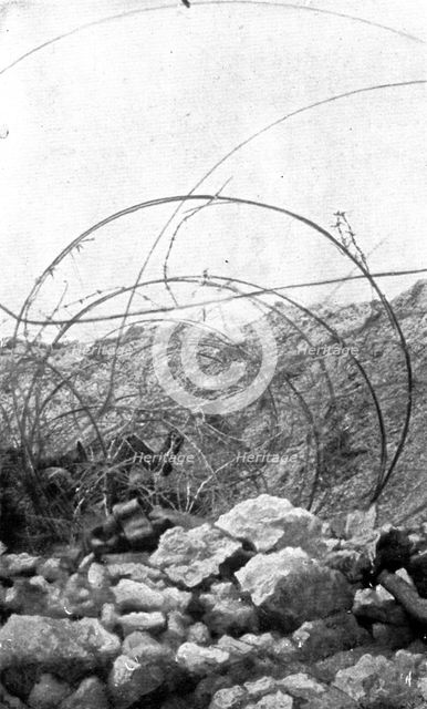 Life in the trenches in Champagne; In the wires of an adjoining trench..., 1917. Creator: Unknown.