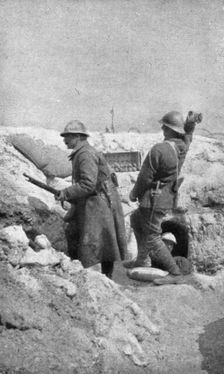 Life in the trenches in Champagne; The outpost re-arms immediately..., 1917. Creator: Unknown