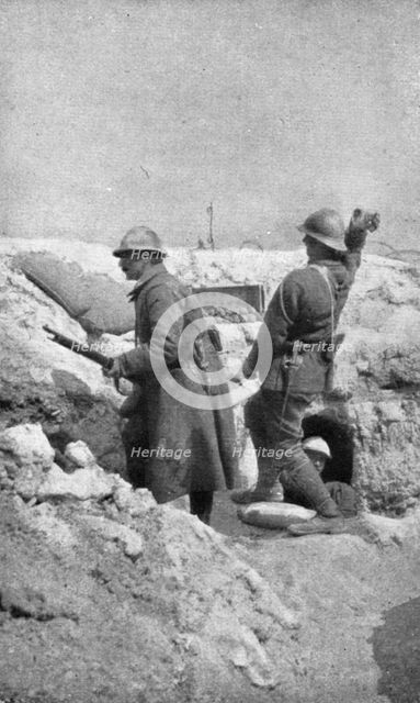 Life in the trenches in Champagne; The outpost re-arms immediately..., 1917. Creator: Unknown.