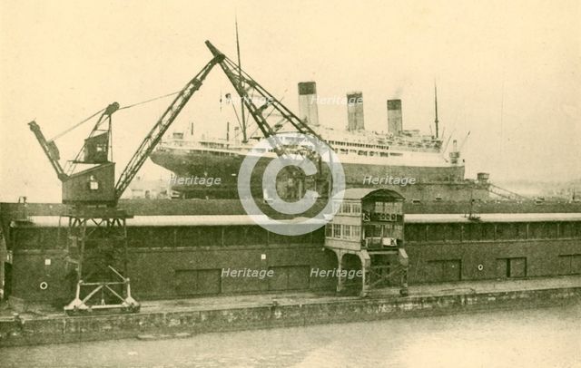 'Lifitng a "Majestic" (56,551 Tons) in the Floating Dock at Southampton', c1930. Creator: Unknown.