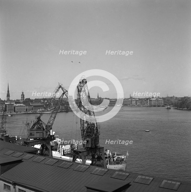 Lifting cranes at the city courtyard, Stockholm harbour, Sweden, 1950.

 Creator: Unknown.