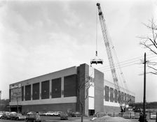 Lifting heat exchangers into place, Silver Blades Ice Rink, Sheffield, South Yorkshire, 1966. Creator: Michael Walters