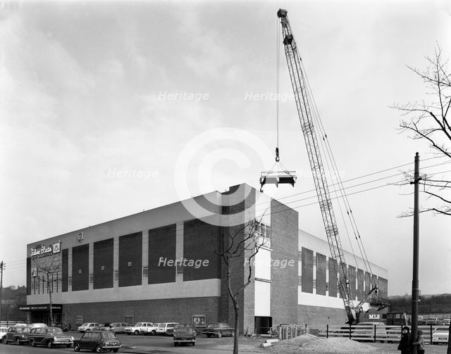 Lifting heat exchangers into place, Silver Blades Ice Rink, Sheffield, South Yorkshire, 1966. Creator: Michael Walters.