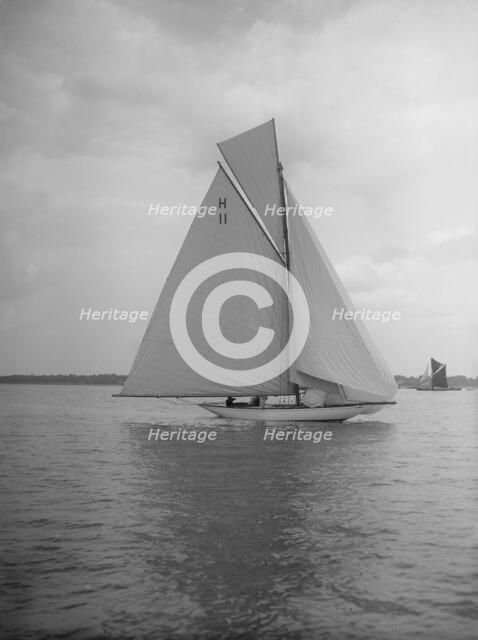 Light winds for the 8 Metre 'Ventana' (H11) sailing with spinnaker, 1912. Creator: Kirk & Sons of Cowes.