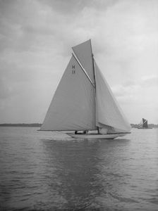 Light winds for the 8 Metre Ventana (H11) sailing with spinnaker, 1912. Creator: Kirk & Sons of Cowes