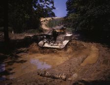 Light tank going through water obstacle, Ft. Knox, Ky., 1942. Creator: Alfred T Palmer