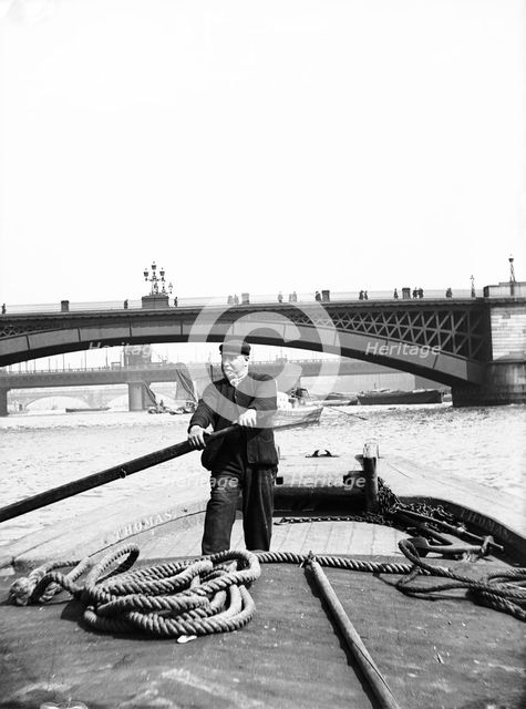 Lighter on the Thames going downstream towards Southwark Bridge, London, c1905. Artist: Unknown