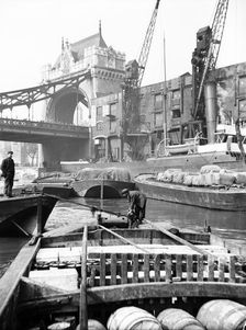 Lighters approaching the General Steam Navigation Company's wharf by Tower Bridge, London, c1905