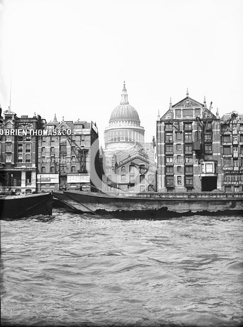 Lighters passing St Paul's Wharf with St Paul's Cathedral in the background, London, c1905. Artist: Unknown